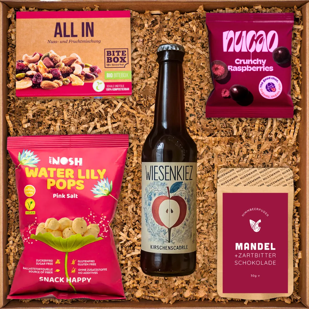 Geschenkbox mit Nuss-Frucht-Mischung, Water Lily Pops, Wiesenkiez-Getränk, Schokolade und Himbeerpuder.